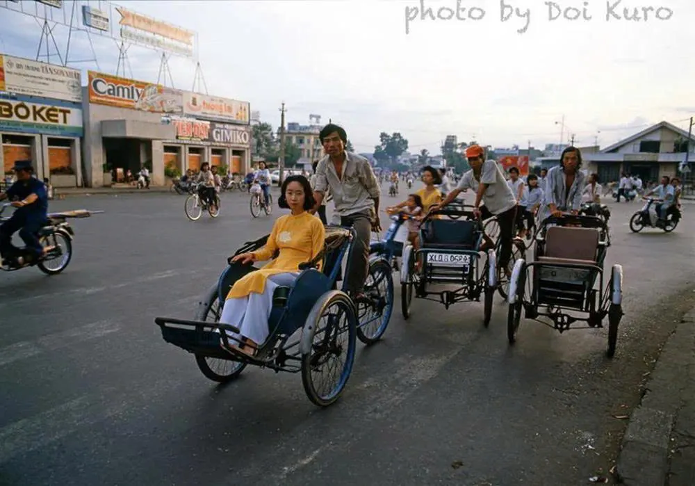 A cyclo carrying a girl at Ben Thanh Market in the old days
