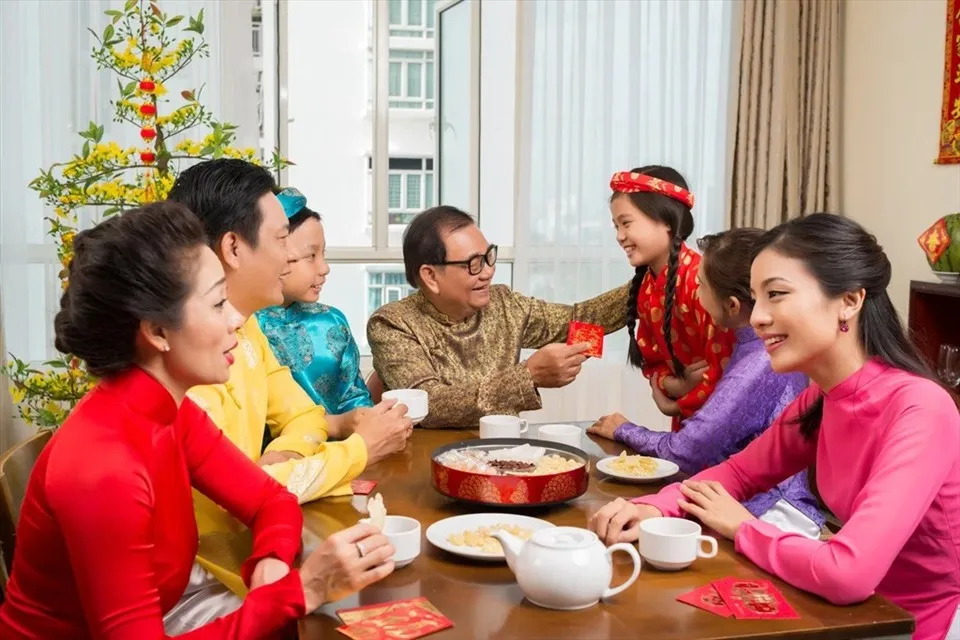 People are happy together when Tet (Lunar New Year) comes.