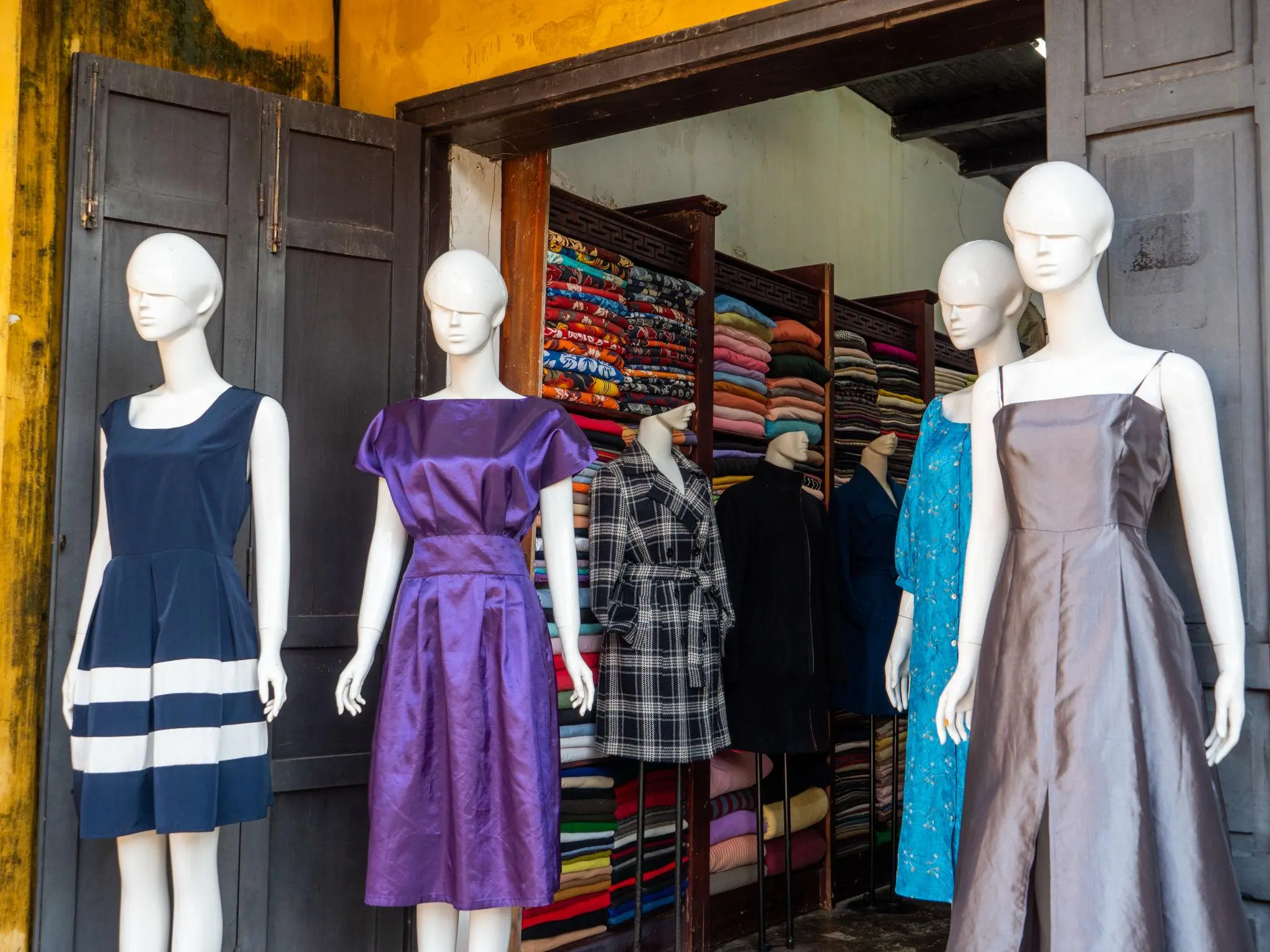Tailored dress fitting in Hoi An tailoring shop