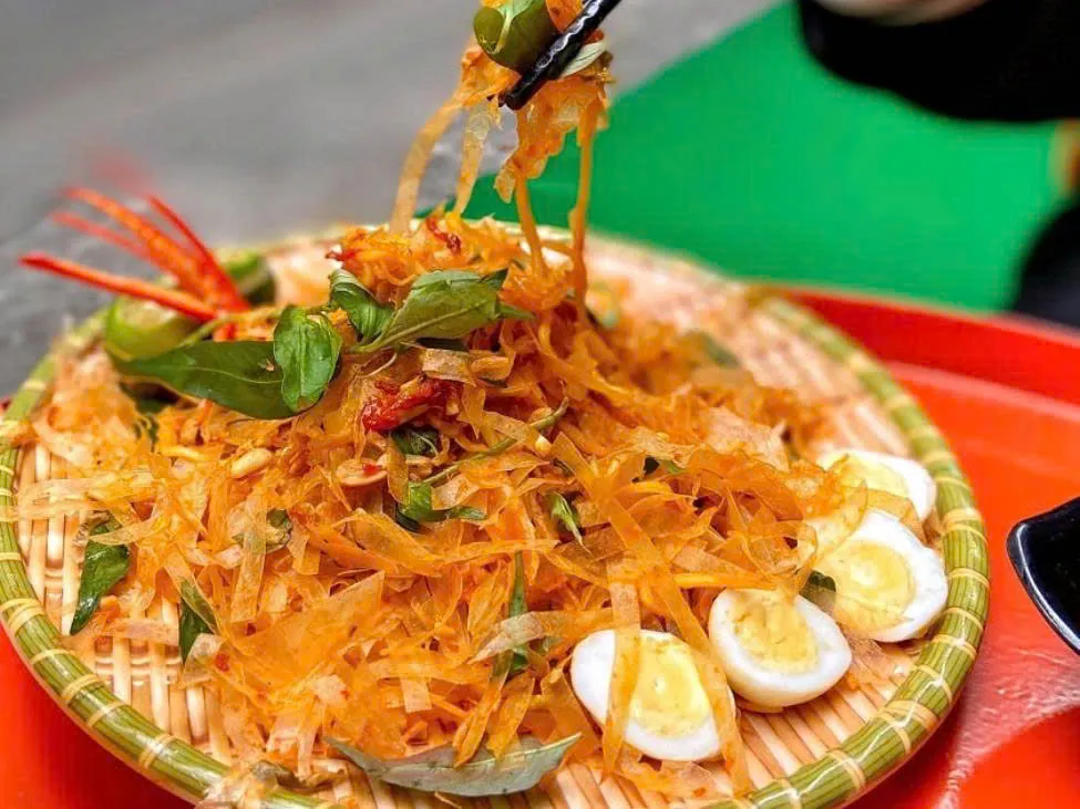 Banh trang tron (mixed rice paper) street food in Saigon