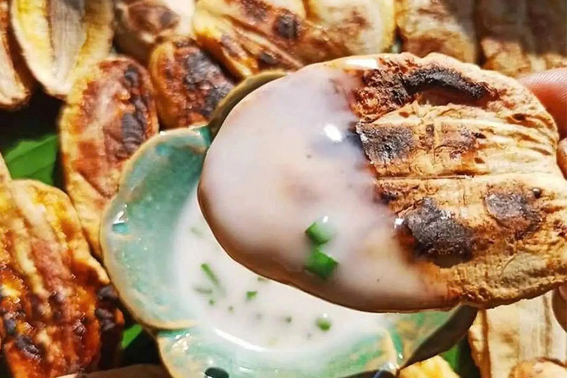 Chuoi nuong (grilled banana with coconut milk) street food in Saigon