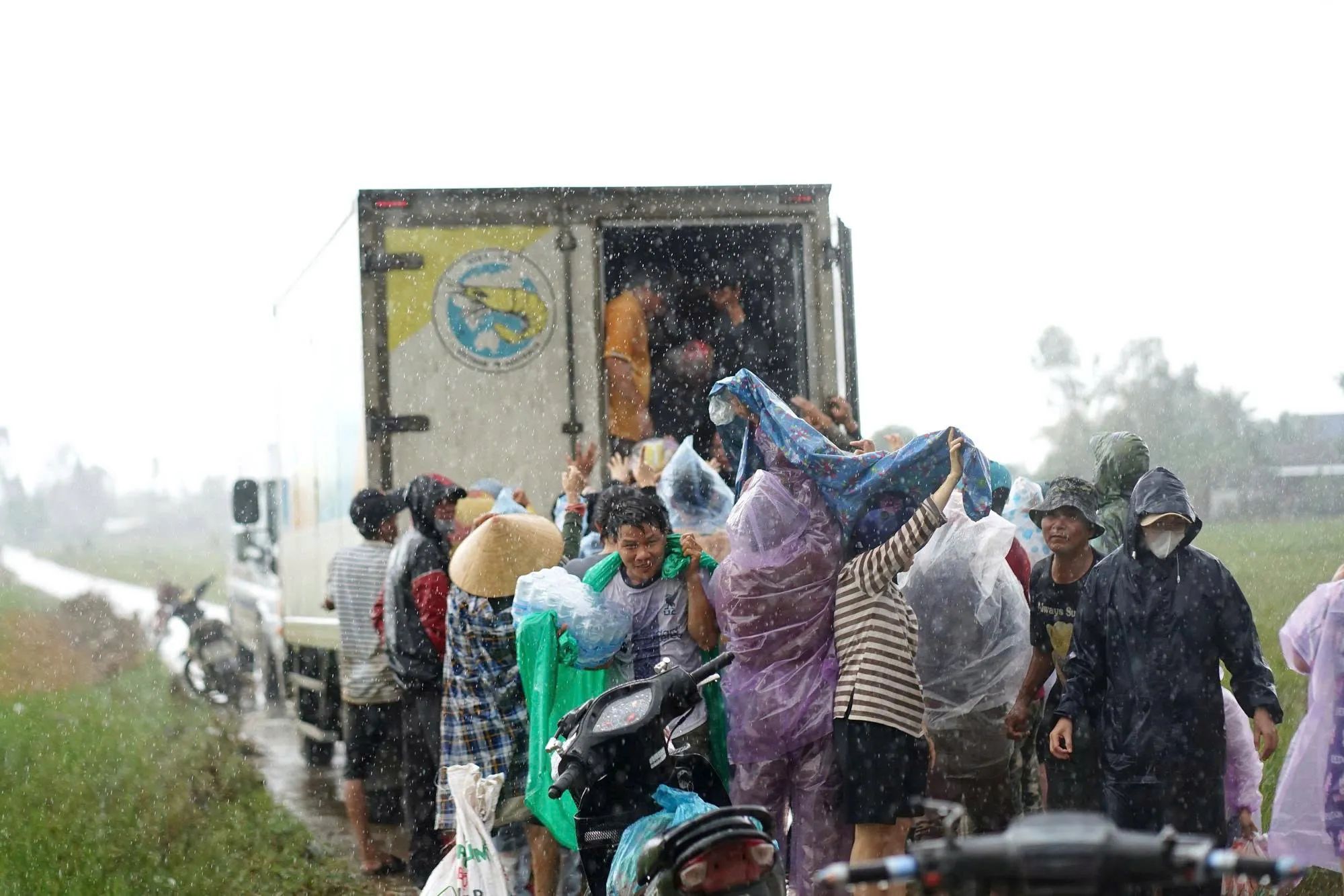 Residents queue for relief aid