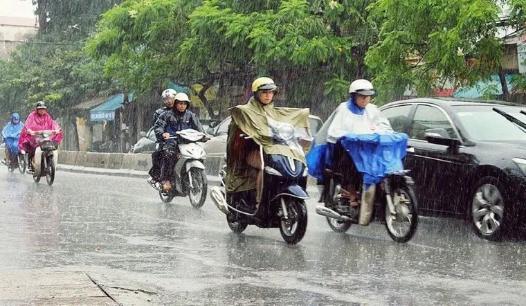 riding Vietnam scooter in the rain