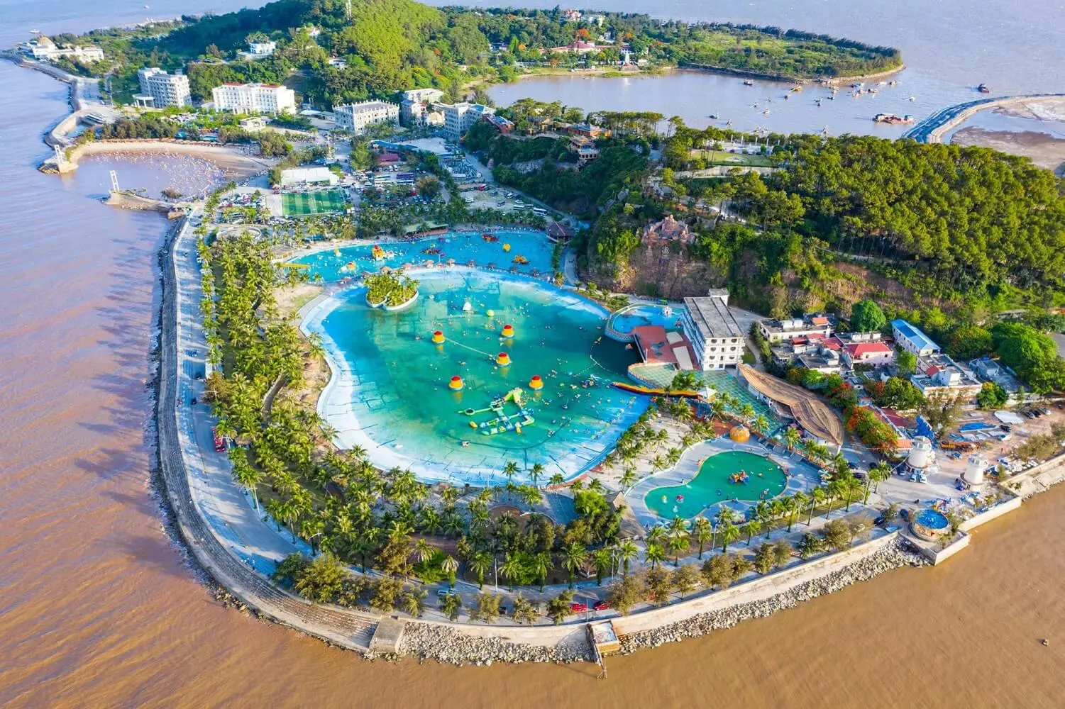 swimming pool and gardens at Hon Dau Resort Hai Phong