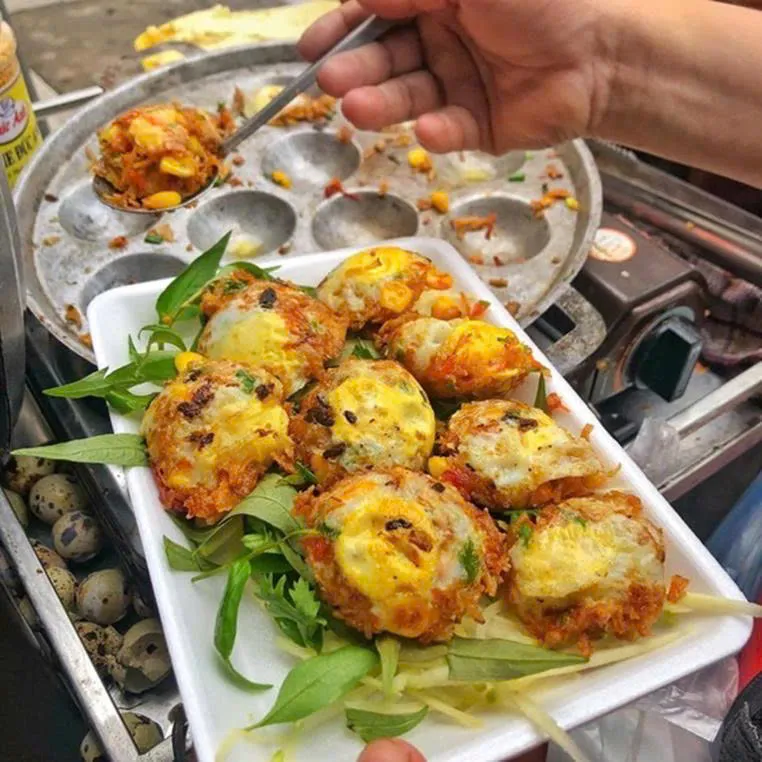 Trung cut nuong (grilled quail egss) street food in Saigon