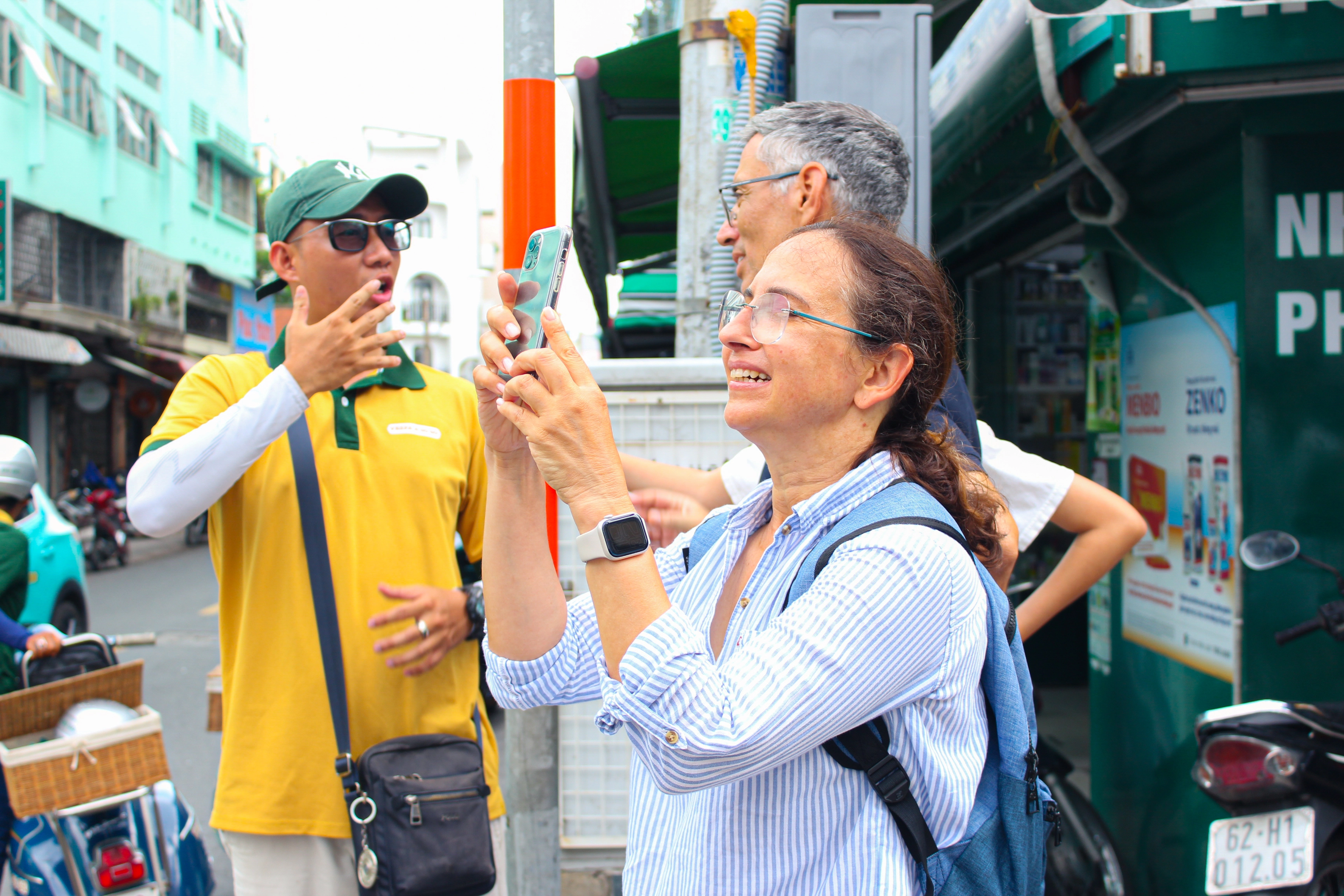 Excited guests exploring Saigon with Vespa A Go Go