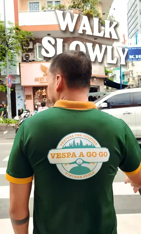 keep a steady pace crossing the Ho Chi Minh City traffic